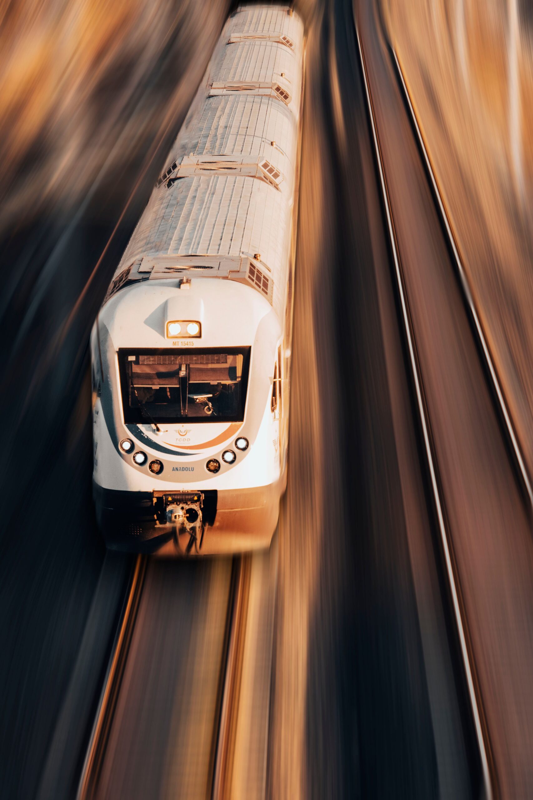 A high-speed train captured from above, showcasing dynamic motion in Karaman, Türkiye.